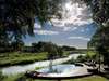Tinga Legends Lodge - pool overlooking river